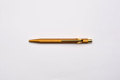 Caran d'Ache 849 Metal Ballpoint Pen - Goldbar With Metal Slim Pack Case